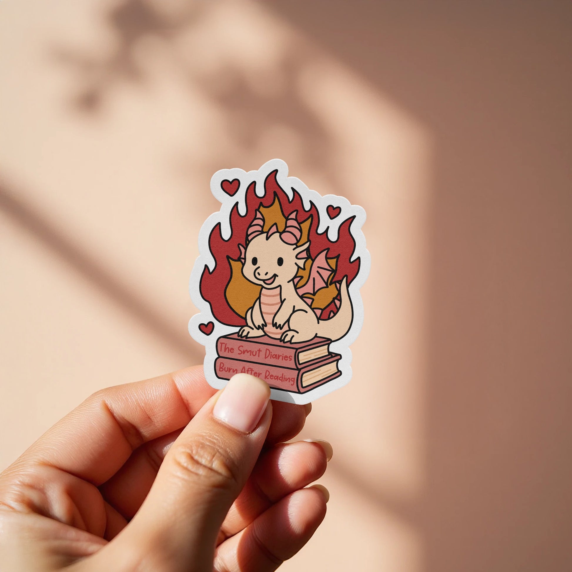 Adorable Fire-Breathing Dragon Holding Books Sticker product
